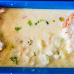A picture of Mashed potato curry and Bread.