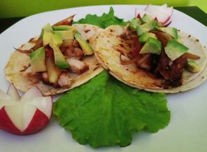 Una foto de Tacos de lomo flameado a la naranja