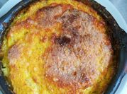 Una foto de pastel de choclo y carne