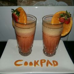 A picture of Orange strawberry smoothy.