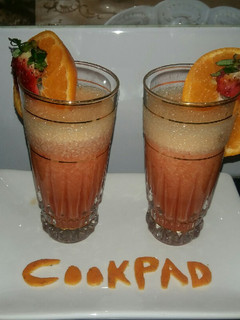 A picture of Orange strawberry smoothy.