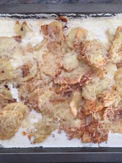Una foto de Patatas con crema de leche y queso emental