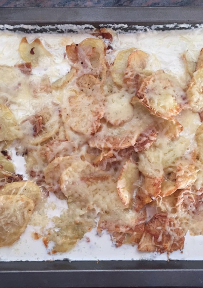 Una foto de Patatas con crema de leche y queso emental