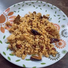 A picture of Vangi Bath (Brinjal fried rice).