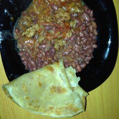 A picture of Beans soup served with chappati.