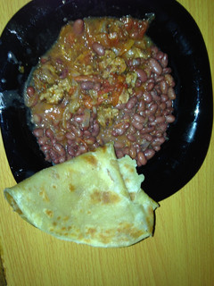 A picture of Beans soup served with chappati.