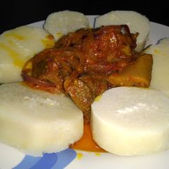 A picture of Boiled yam and snail n assorted gravy.