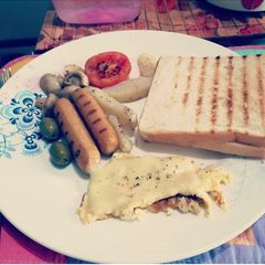 Cheese Spanish omelette grilled sausage mushroom,olives& toast A picture of Cheese Spanish omelette grilled sausage mushroom,olives& toast.