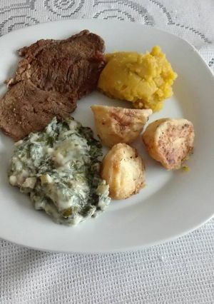 A picture of Steak and vegetables.