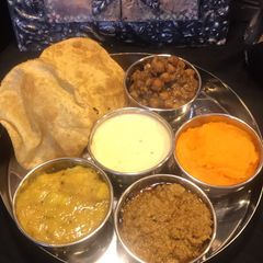 Halwa poori thalliPart 5 (kheer) rice pudding A picture of Halwa poori thalliPart 5 (kheer) rice pudding.