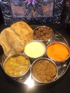 A picture of Halwa poori thalliPart 5 (kheer) rice pudding.