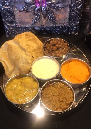 A picture of Halwa poori thalliPart 5 (kheer) rice pudding.
