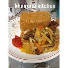 A picture of Amiwo(jollof din tuwo masara).