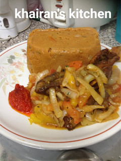 A picture of Amiwo(jollof din tuwo masara).