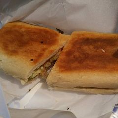 A picture of Cuban Bread Meat lovers Sandwich.