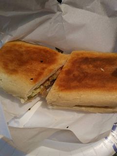 A picture of Cuban Bread Meat lovers Sandwich.
