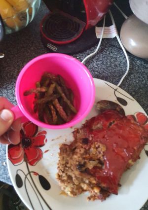 A picture of Twice baked meatloaf and microwave Asparagus.
