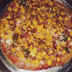 A picture of Corn paneer pizza.