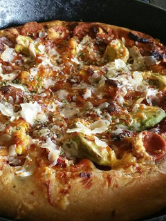 A picture of Bbq pepperoni deep dish pizza in a Cast Iron skillet.