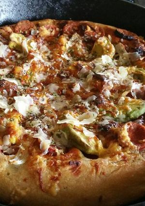 A picture of Bbq pepperoni deep dish pizza in a Cast Iron skillet.