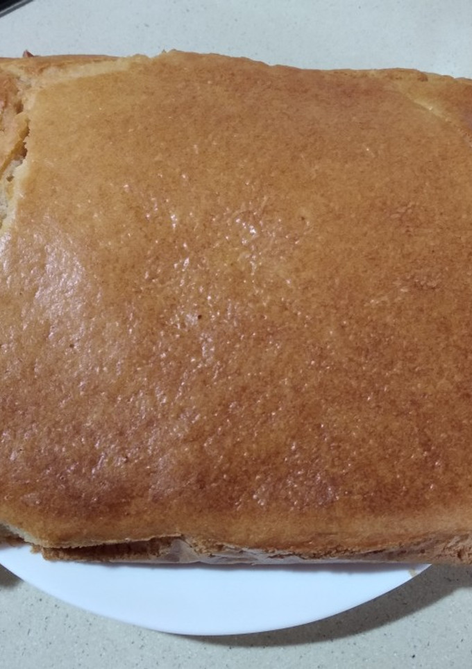 Una foto de Coca de coco y almendras picadas