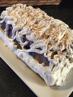 Una foto de Pastel de coco y arándanos