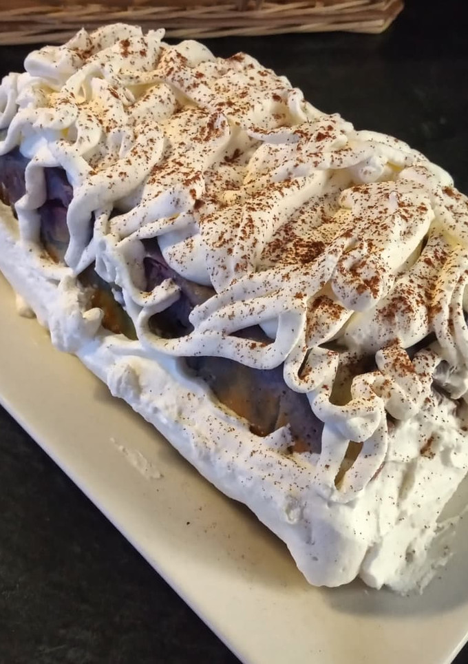 Una foto de Pastel de coco y arándanos