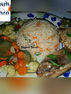 A picture of Carrot rice/veg sauces/fried fish.