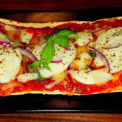 A picture of Mike's 10 Minute Salt Brick Pizza Margheritas.