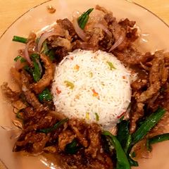 A picture of Beef chili dry with fried rice.