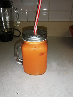 A picture of Freshly squeezed carrot and grapefruit juice.