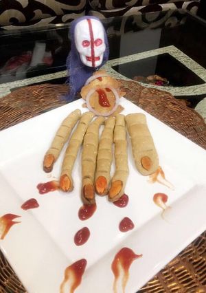 A picture of #Halloween#Whole wheat baked mathri in khooni hand shape.