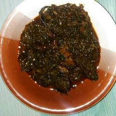 A picture of Ugwu with water leaf soup.