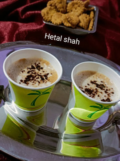 A picture of Hot Coffee with Cocoa Powder.
