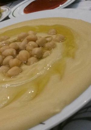 A picture of Hummus with Olive Oil.