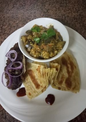 A picture of Eggplantscurry,goatsufuriaroast andchapati#weeklyjokochallenge&.