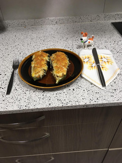 Una foto de Berenjenas rellenas de merluza y gamba