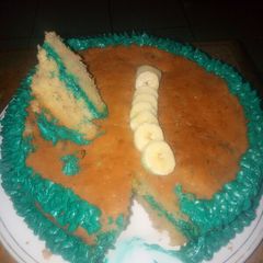 A picture of Banana cake with Banana Lemon juice cream frosting.