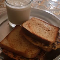 A picture of Besan Chilla with Brown Bread and Cold Coffee.