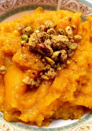 A picture of Suji halwa/ puri wala.