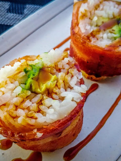 A picture of Bacon wrapped rice balls.