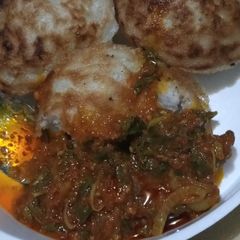 A picture of Masa and spinach sauce.
