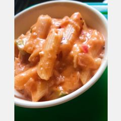 A picture of Pink penne cheese pasta.