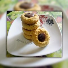 A picture of Chocolate thumbprint cookies.