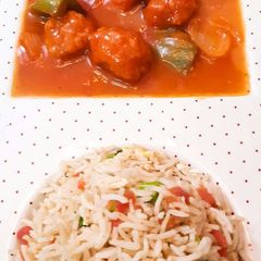 A picture of Vegetable fried Rice with Chicken Shashlik.