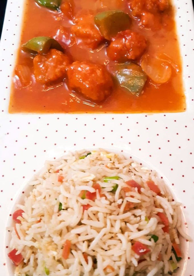 A picture of Vegetable fried Rice with Chicken Shashlik.