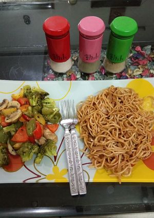A picture of Sauteed vegetables with noodles.