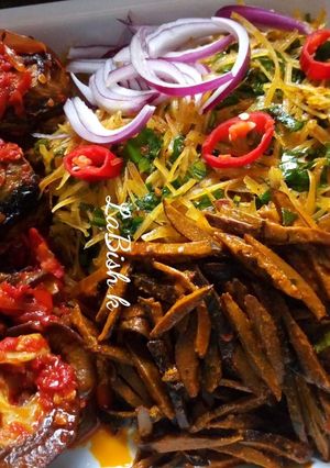 A picture of Abacha and ugba with fried fish.