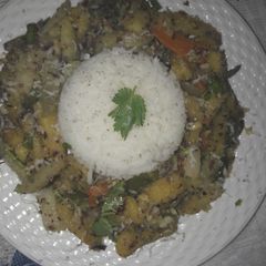 A picture of Poriyal with steamed rice.