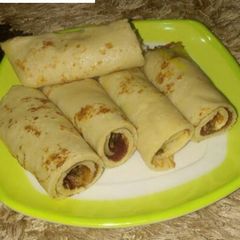 A picture of Pancake roll with sardines sauce.